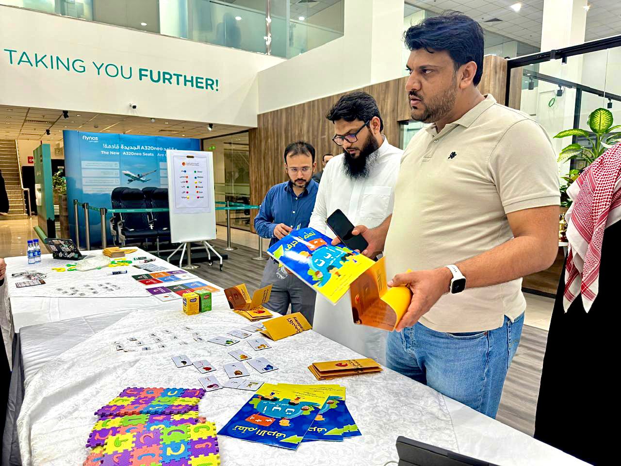flynas employees taking part in Arabic language and culture competitions on World Arabic Language Day